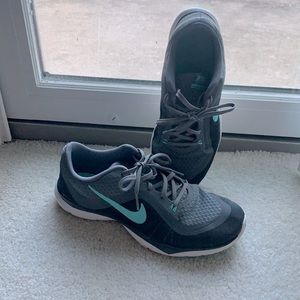 Nike training shoes with turquoise/sky blue check